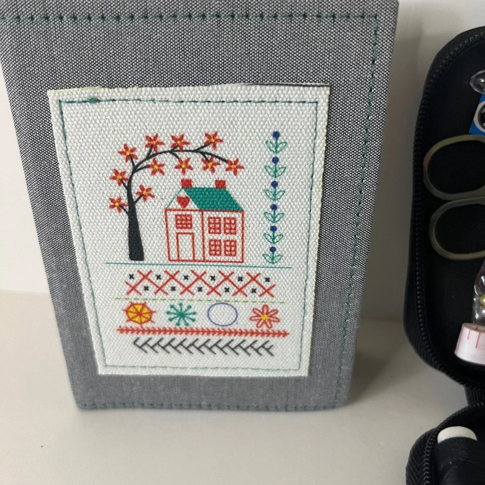 Compact Gray Sewing Kit with Multicolor Thread & Tools